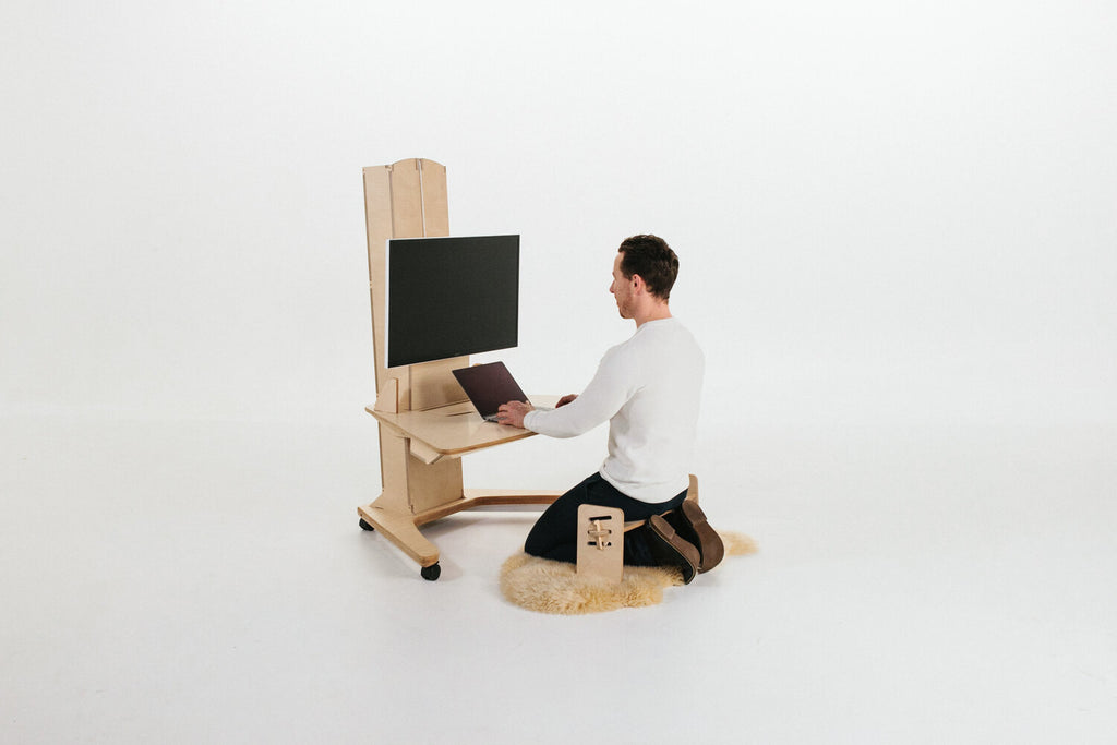 Petal Limber Dynamic Desk in  kneeling position